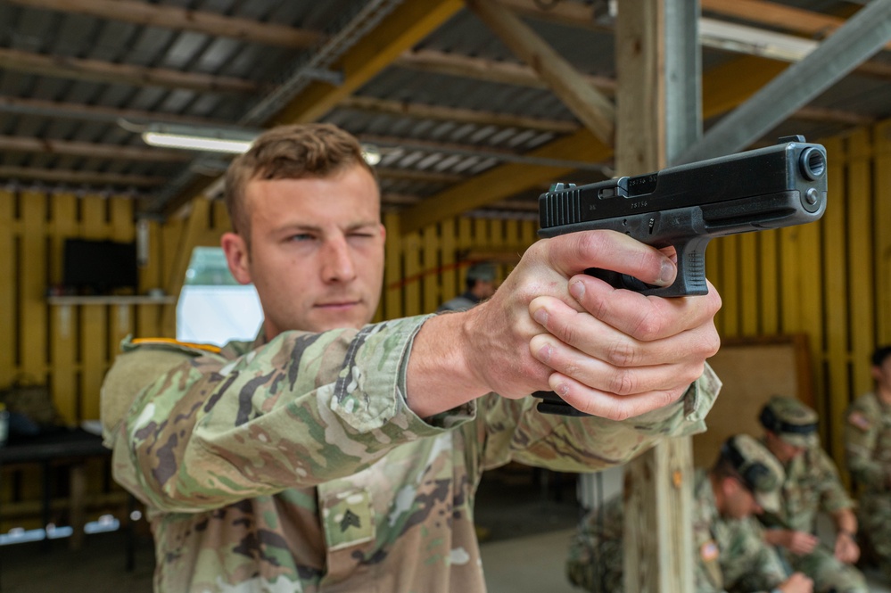 Army Reserve Sgt. Conner Williams practices his pistol marksmanship