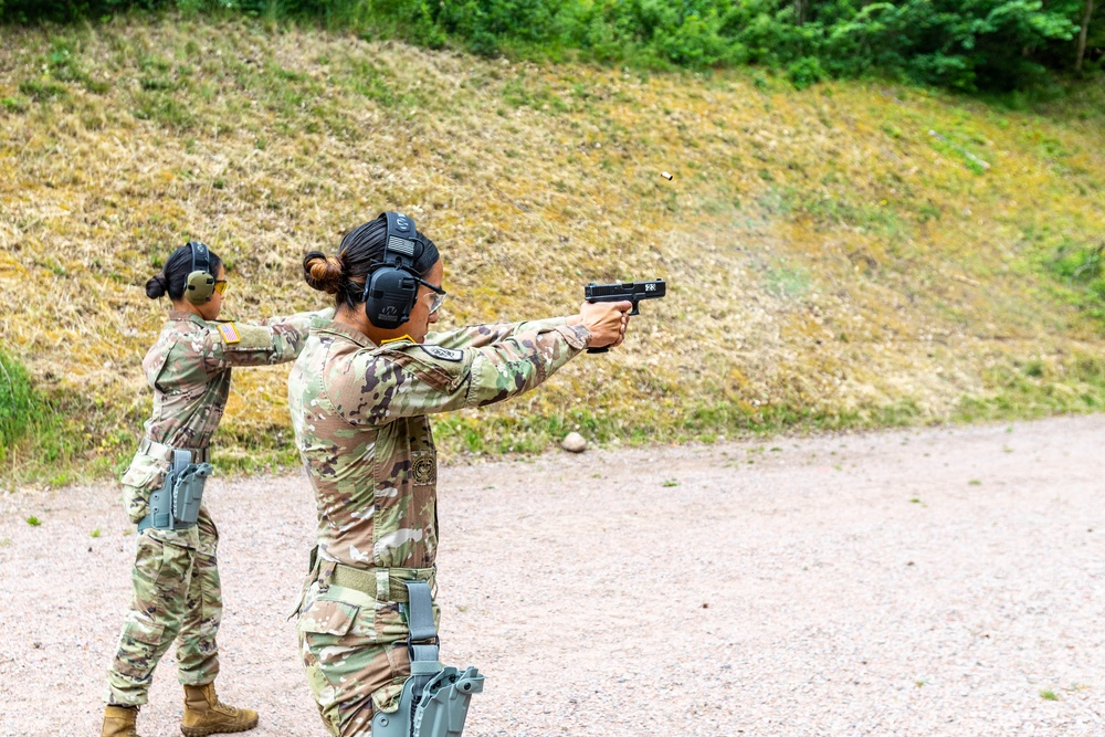 Army Reserve Sgt. Christine Won and Army Reserve 1st Lt. Jessica Romero fire Glocks