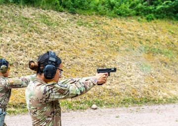 Army Reserve Sgt. Christine Won and Army Reserve 1st Lt. Jessica Romero fire Glocks
