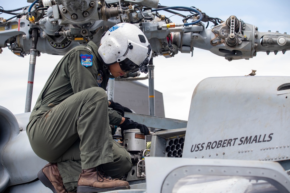 USS Robert Smalls (CG 62) Sailor Conducts Pre Flight on MH-60R