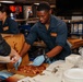 Abraham Lincoln hosts pizza party for on duty Sailors