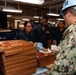 Abraham Lincoln hosts pizza party for on duty Sailors