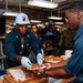 Abraham Lincoln hosts pizza party for on duty Sailors