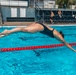 Army Reserve 1st Lt. Brianna Mirmina dives into a pool