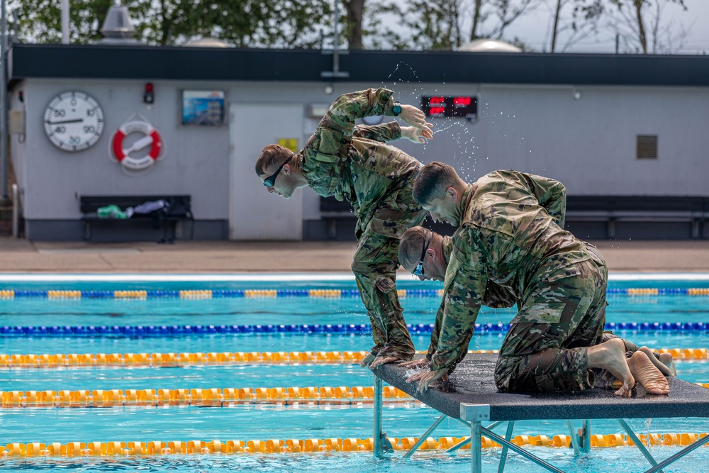 U.S. Army Reserve CIOR competitors complete a swim obstacle