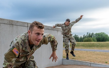 Army Reserve Sgt. Conner Williams practices an obstacle course