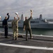 Sailors render honors to USS Anchorage as it returns to home port