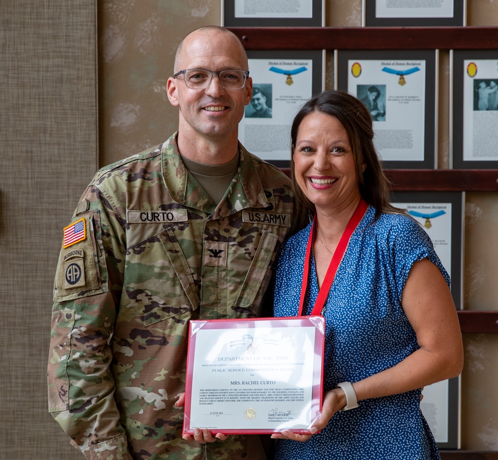 Maj. Gen. John V. Meyer III presents awards to 1st Infantry Division Staff Judge Advocate