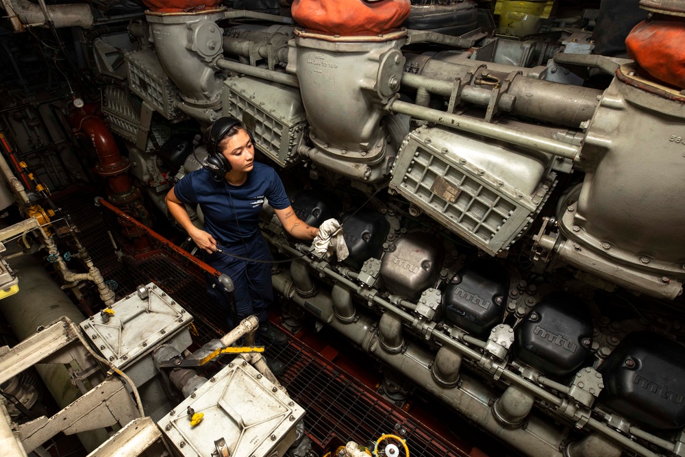 U.S. Coast Guard Cutter Stratton Sailor Checks Engine Oil