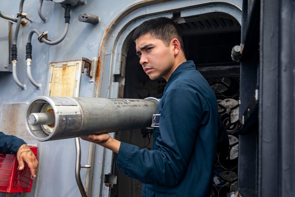 Sailors Aboard USS John Finn (DDG 113) Conduct Ammo Upload