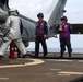 USS Robert Smalls (CG 62) Sailor Signals During Hot Pump at Flight Quarters