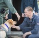 Ford Facility Dog Sage Visits USS Normandy