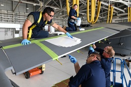 Brushing up on history: 911th Airlift Wing adds World War II invasion stripes to C-17 Globemaster III