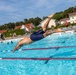 Army Reserve Staff Sgt. Devin Crawford dives into a pool