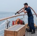 USCGC Eagle's crew maintains equipment underway