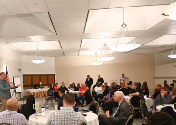 Capt. Cory Schemm addresses supervisors during opening remarks at command offsite.