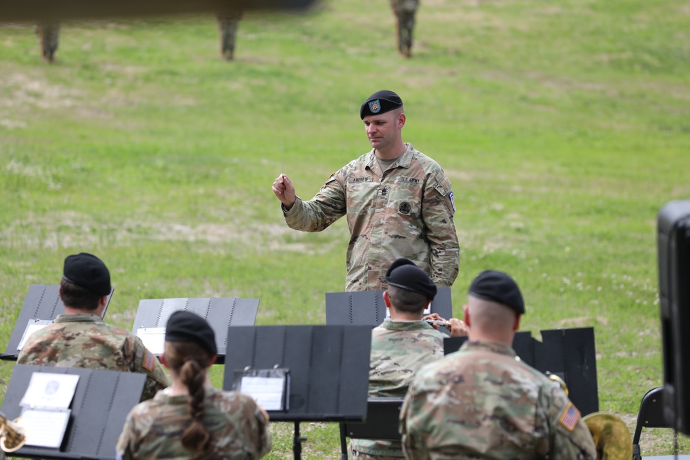 1st Sgt. Phillip Andrew directs the 10th Mountain Division band at a rededication ceremony on Whiteface Mountain