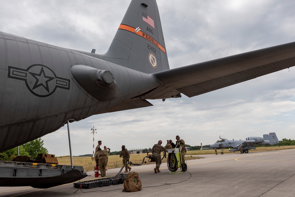 U.S. Airmen refuel an A-10 Thunderbolt from a C-130 Hercules