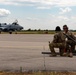 U.S. Airmen refuel an A-10 Thunderbolt from a C-130 Hercules