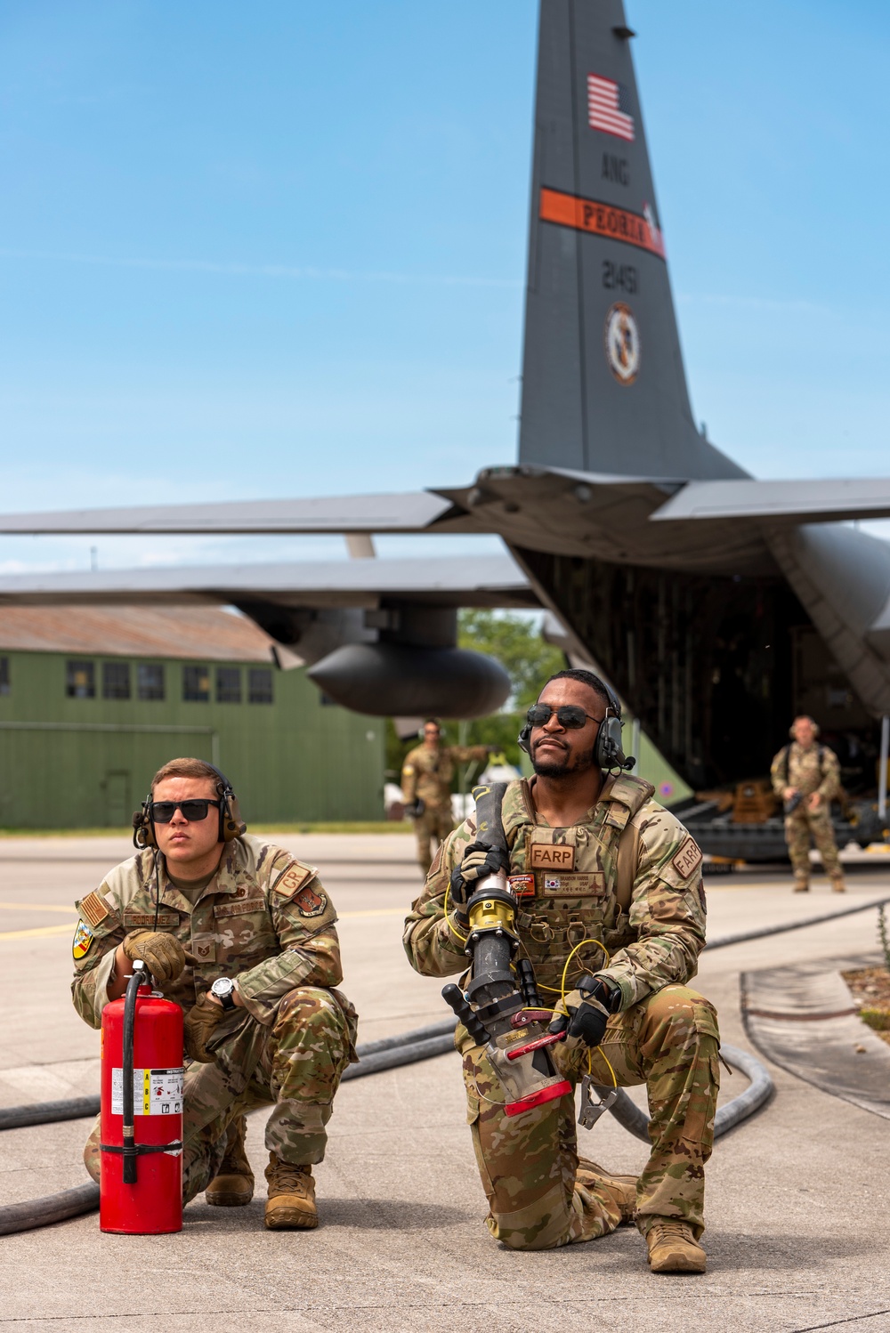 U.S. Airmen refuel an A-10 Thunderbolt from a C-130 Hercules