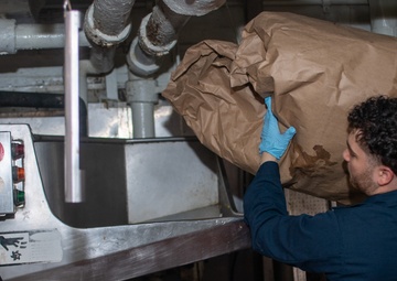 USS Ronald Reagan (CVN 76) Sailors process waste