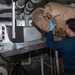 USS Ronald Reagan (CVN 76) Sailors process waste