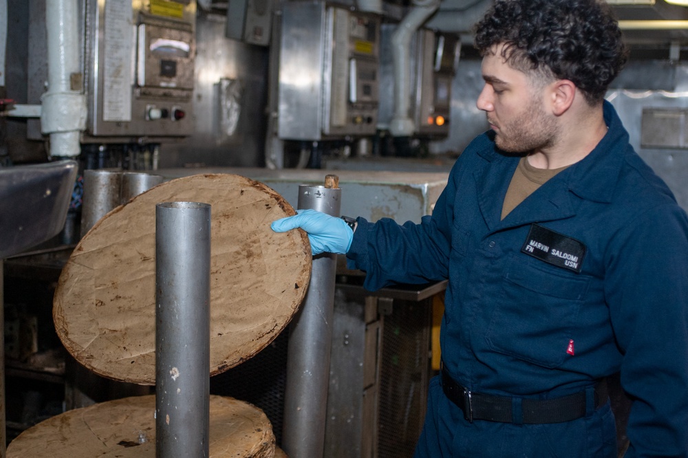 USS Ronald Reagan (CVN 76) Sailors process waste