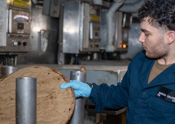 USS Ronald Reagan (CVN 76) Sailors process waste