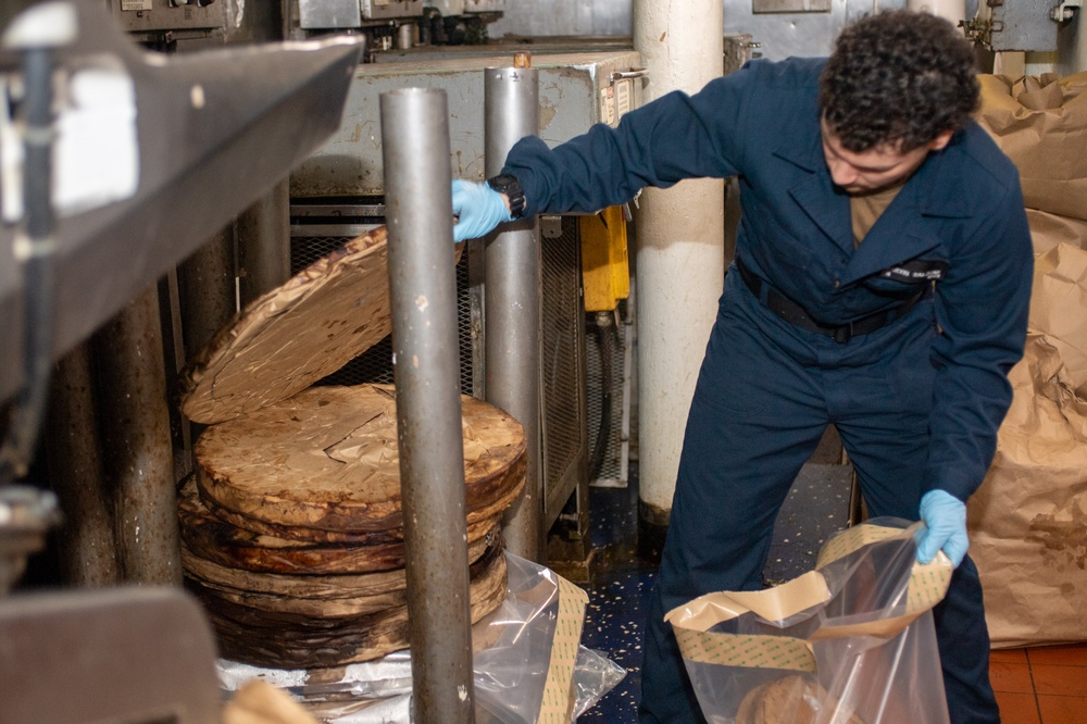 USS Ronald Reagan (CVN 76) Sailors process waste