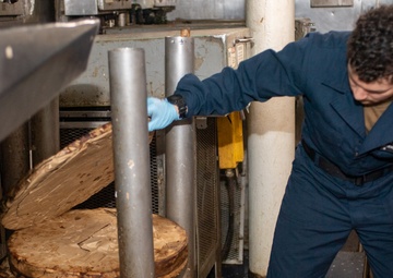 USS Ronald Reagan (CVN 76) Sailors process waste