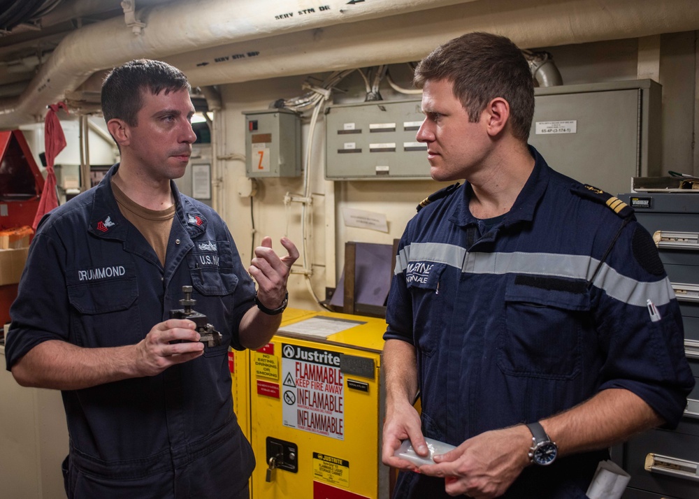 USS Ronald Reagan (CVN 76) machine repair shop hosts French naval officer