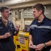 USS Ronald Reagan (CVN 76) machine repair shop hosts French naval officer