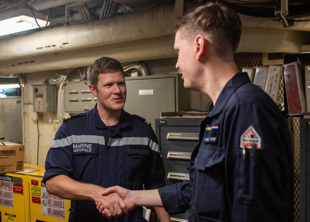 USS Ronald Reagan (CVN 76) machine repair shop hosts French naval officer