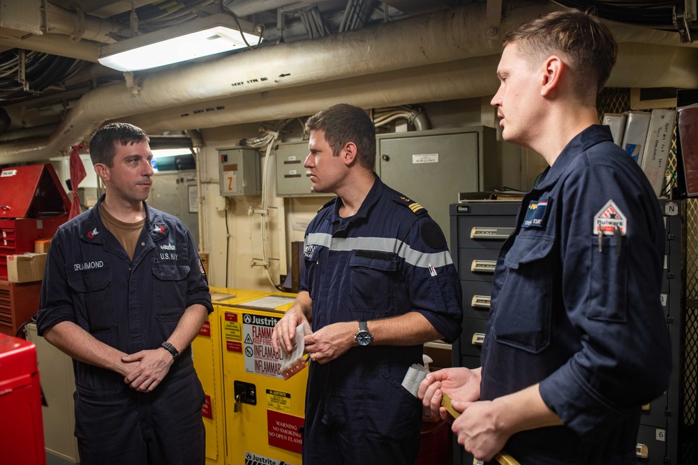 USS Ronald Reagan (CVN 76) machine repair shop hosts French naval officer