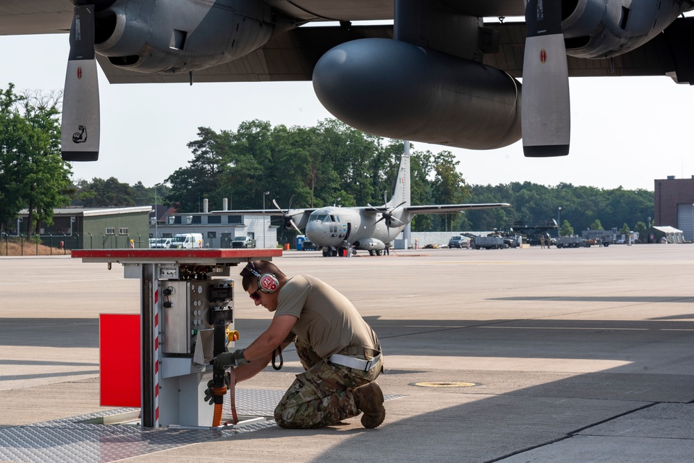 U.S. Airman prepares a C-130 Hercules aircraft for a flight at exercise Air Defender 2023