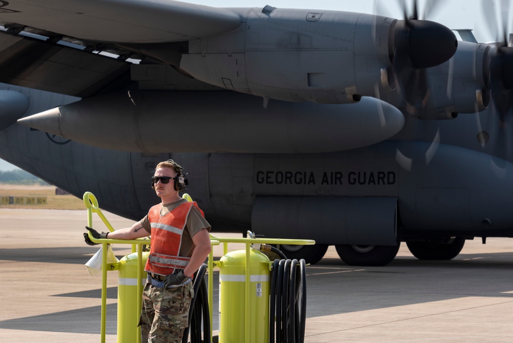 U.S. Airman prepares a C-130 Hercules aircraft for a flight at exercise Air Defender 2023