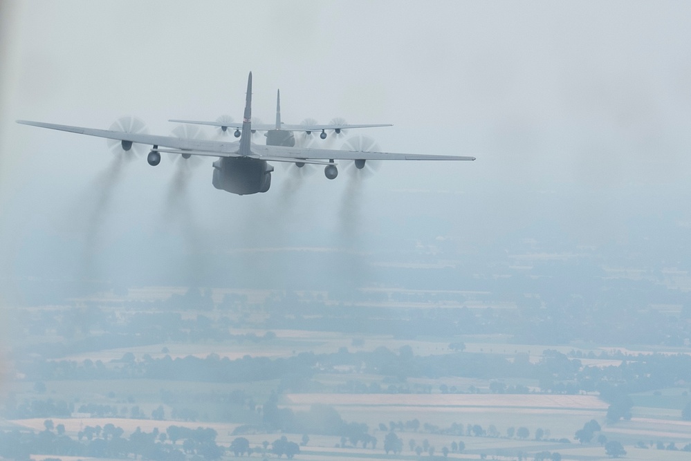 Two U.S. Air Force C-130 Hercules aircrafts perform tactical maneuvers at exercise Air Defender 2023