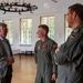 U.S. Air Force Col. Rusty Ballard, Col. Christian John, and Mayor Carsten Piellusch converse at exercise Air Defender 2023