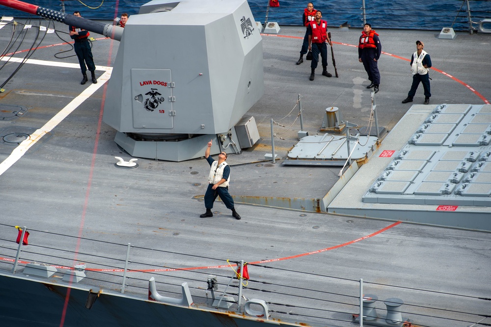 USS Ronald Reagan (CVN 76) conducts fueling-at-sea with USS Rafael Peralta (DDG 115)