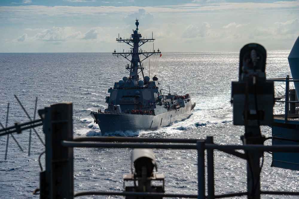 USS Ronald Reagan (CVN 76) conducts fueling-at-sea with USS Rafael Peralta (DDG 115)