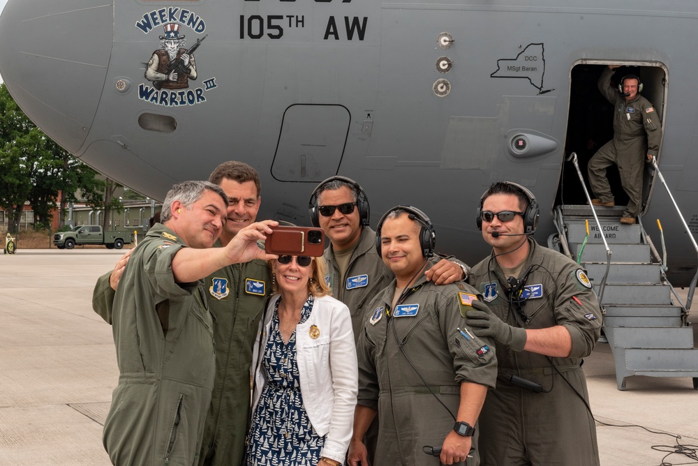 U.S. Air Force General Loh, director, Air National Guard, takes a group photo in front of C-17 Globemaster III