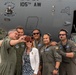 U.S. Air Force General Loh, director, Air National Guard, takes a group photo in front of C-17 Globemaster III