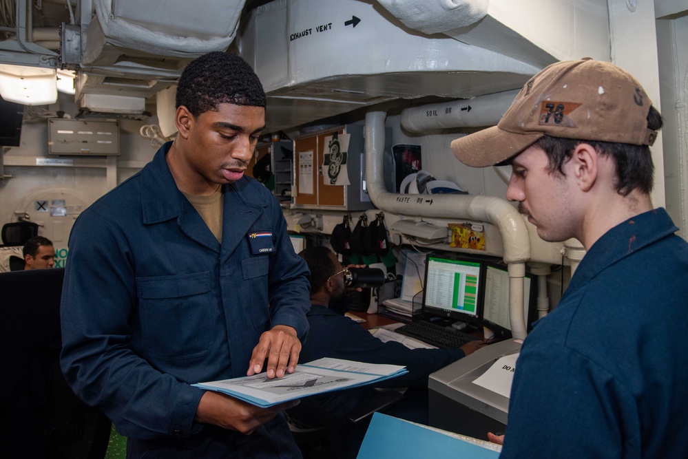 USS Ronald Reagan (CVN 76) Safety department Sailors process paper work