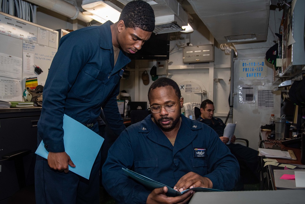 USS Ronald Reagan (CVN 76) Safety department Sailors process paper work