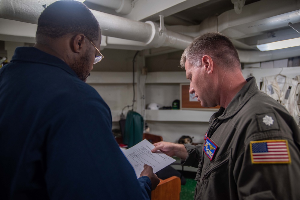 USS Ronald Reagan (CVN 76) Safety department Sailors process paper work