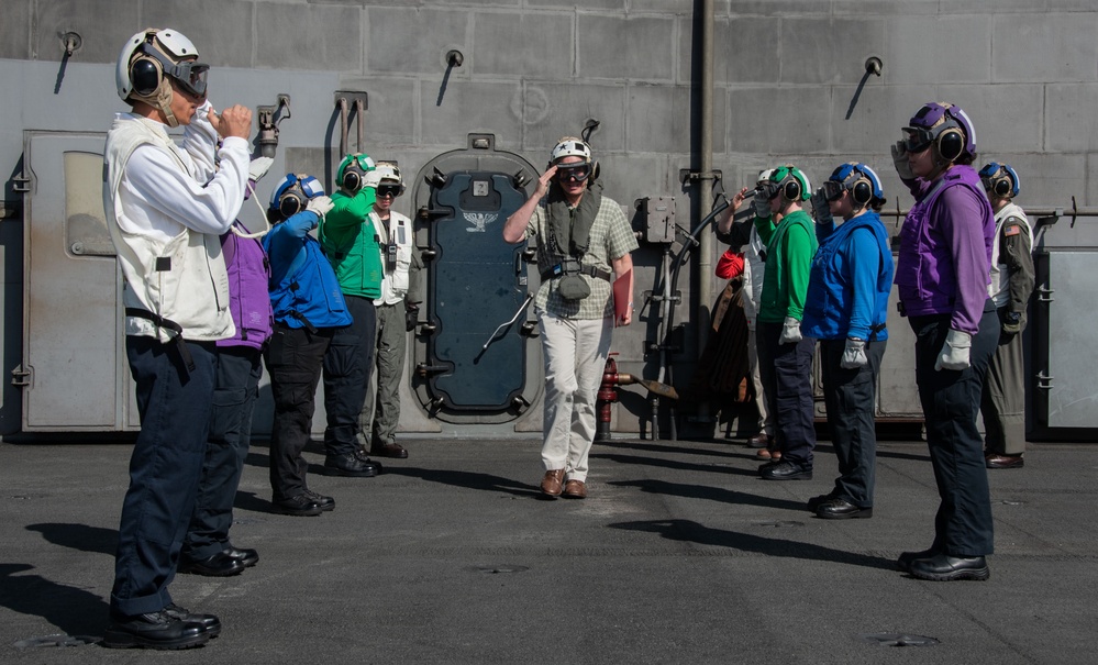 USS Ronald Reagan (CVN 76) Sailors render honors to Rear Adm. Buzz Donnelly