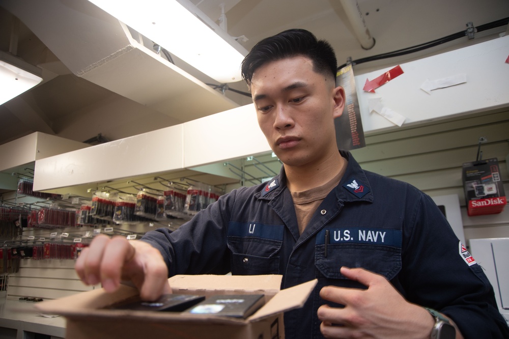 USS Ronald Reagan (CVN 76) Sailors man ship’s store.