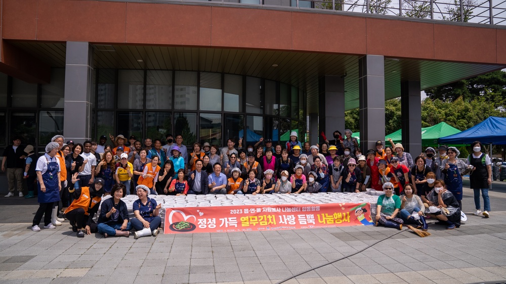 Unit Ministry Team and volunteers cook Kimchi for people in need of assistance.
