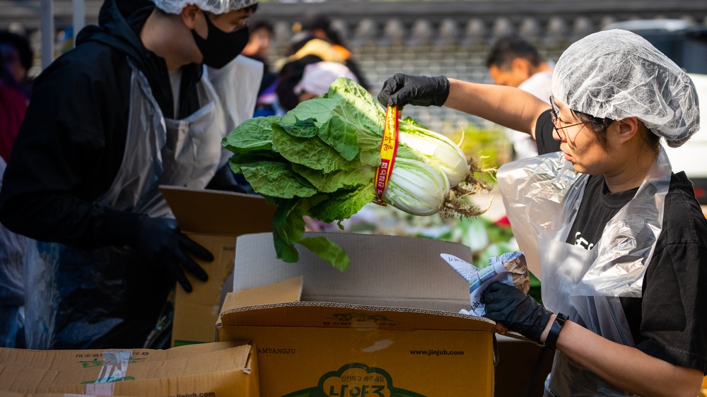 Unit Ministry Team and volunteers cook Kimchi for people in need of assistance.
