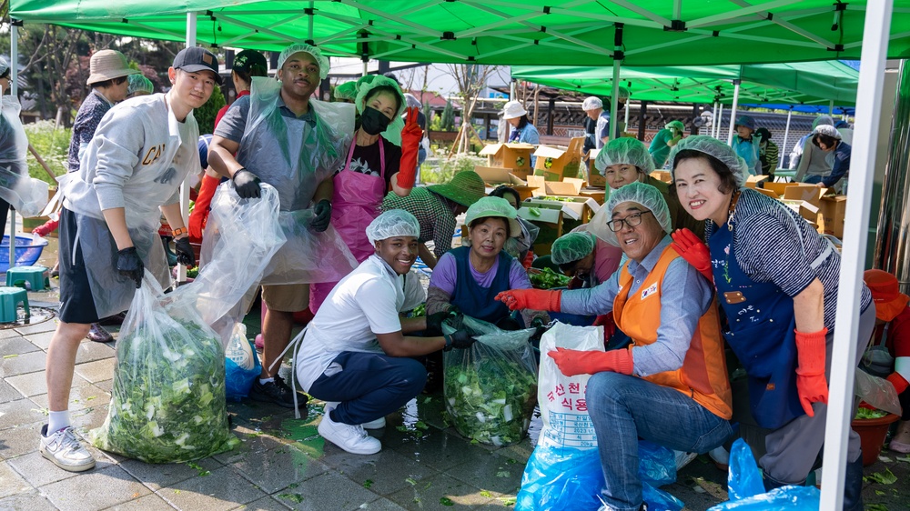Unit Ministry Team and volunteers cook Kimchi for people in need of assistance.